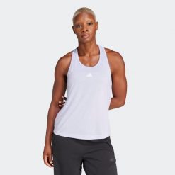 Koszulka fitness damska ADIDAS bez rękawów. Fioletowe koszulki damskie Adidas, l, bez wzorów, z materiału, bez kołnierzyka, bez ramiączek. W wyprzedaży za 79.99 zł.