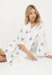 Biała Sukienka Oversize z Wiskozą Zdobiona Haftem i Falbanką Ilarith. Białe sukienki damskie Born2be, z aplikacjami, z bawełny, eleganckie, bez ramiączek. Za 169.99 zł.