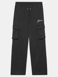 Guess Spodnie dresowe J4YQ13 KA6R3 Czarny Relaxed Fit. Czarne spodnie dresowe dziewczęce Guess, z aplikacjami, z bawełny. Za 119.99 zł.
