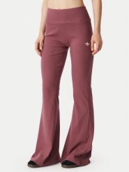 Adidas Legginsy Essentials KT4760 Różowy ciemny Flared Leg. Czerwone legginsy damskie Adidas, s, bez wzorów, z wiskozy. Za 219.99 zł.