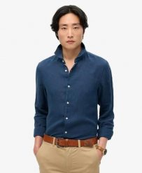 Superdry Koszula lniana Vacation z długim rękawem – NAVY. Niebieskie koszule damskie Superdry, na lato, xl, bez wzorów, ze lnu, klasyczne, bez kołnierzyka, bez ramiączek. Za 317.00 zł.