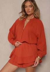 Pomarańczowy Kombinezon z Bawełny ze Spódnico-Spodenkami i Guzikami oraz Gumką w Talii Vimatthea. Brązowe sukienki damskie Renee, bez wzorów, z bawełny, eleganckie, bez ramiączek. W wyprzedaży za 143.99 zł.