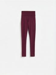 Gładkie legginsy - mahoniowy. Brązowe legginsy damskie Reserved, l, bez wzorów, z dzianiny. Za 89.99 zł.