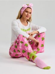 Bawełniana piżama dwuczęściowa Grinch - kremowy. Białe piżamy damskie Sinsay, bez wzorów, z bawełny, bez ramiączek. Za 55.99 zł.