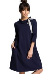 Sukienka sportowa bombka oversize z kieszeniami i wiązaniem granat. Sukienki damskie Bewear, bez wzorów, sportowe, bez ramiączek. Za 289.00 zł.