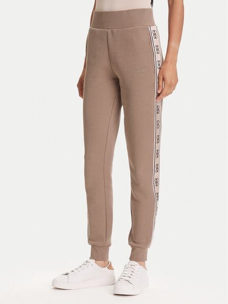 Guess Spodnie dresowe V2YB15 KB3P2 Brązowy Regular Fit. Brązowe spodnie dresowe damskie Guess, s, z aplikacjami, z bawełny. Za 219.99 zł.