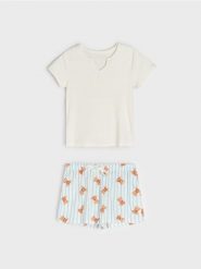 Bawełniana piżama dwuczęściowa z motywem misia - biały. Białe piżamy damskie Sinsay, bez wzorów, z bawełny, bez ramiączek. Za 39.99 zł.