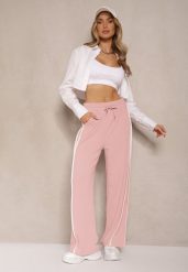 Różowe Szerokie Spodnie Dresowe High Waist Zdobione Lampasami Sopaline. Czerwone spodnie dresowe damskie Renee, l, z aplikacjami, z dresówki. Za 49.99 zł.