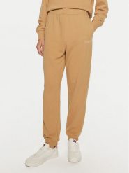 Tommy Hilfiger Spodnie dresowe WW0WW42883 Beżowy Regular Fit. Brązowe spodnie dresowe damskie Tommy Hilfiger, xxl, bez wzorów, z bawełny. Za 419.99 zł.