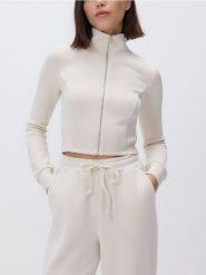 Rozpinana bluza z modalem - kremowy. Białe bluzy damskie Reserved, l, bez wzorów, z dzianiny, bez kaptura. Za 119.99 zł.