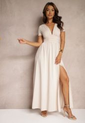 Jasnobeżowa Sukienka Maxi z Rozkloszowanym Dołem i Rozcięciem Zarya. Brązowe sukienki damskie Renee, bez wzorów, bez ramiączek. W wyprzedaży za 143.99 zł.