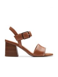 Clarks Skórzane sandały "Siara65 Buckle" w kolorze jasnobrązowym na obcasie rozmiar: 40. Brązowe sandały damskie Clarks, bez wzorów, z otwartym noskiem, bez obcasa, na koturnie, bez zapięcia. Za 184.46 zł.