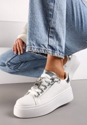Biało-Srebrne Sneakersy z Metaliczną Zawieszką na Sznurówkach Ozdobioną Cyrkoniami Edosa. Białe obuwie sportowe damskie Renee, bez zapięcia, trekkingowe. Za 79.99 zł.