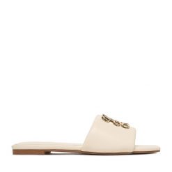 Klapki Nine West. Białe klapki damskie Nine West, bez wzorów, bez obcasa, bez zapięcia. Za 169.99 zł.