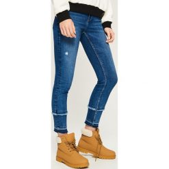 Jeansy slim z frędzlami - Granatowy. Niebieskie jeansy damskie Sinsay. Za 99.99 zł.