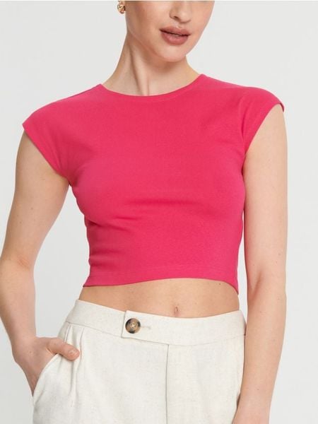 Koszulka crop top - różowy. Czerwone koszulki damskie Sinsay, l, bez wzorów, z bawełny, bez kołnierzyka, bez ramiączek. Za 15.99 zł.