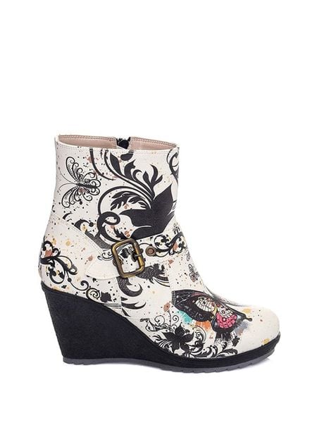 Streetfly Botki w kolorze biało-czarnym rozmiar: 38. Białe botki damskie Streetfly, z materiału, eleganckie, bez obcasa, na koturnie, bez zapięcia. Za 258.52 zł.