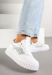 Białe Sneakersy na Grubej Tłoczonej Podeszwie z Perforacją i Panterką Odivila. Białe obuwie sportowe damskie Born2be, z jeansu, bez zapięcia. Za 89.99 zł.