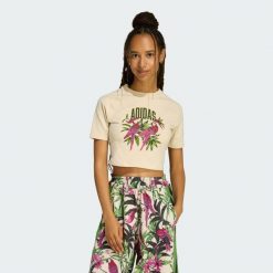 KOSZULKA ADIDAS x FARM RIO GRAPHIC T-SHIRT CROPPED. Białe koszulki damskie Adidas, bez wzorów, bez kołnierzyka, bez ramiączek. Za 149.00 zł.