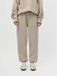 LeGer Spodnie dresowe "Maxime" w kolorze beżowym rozmiar: 38. Brązowe spodnie dresowe damskie LeGer, bez wzorów, z dresówki. Za 100.99 zł.