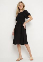 Czarna Rozkloszowana Sukienka Bawełniana z Bufiastymi Rękawami i Elastyczną Górą Veliova. Czarne sukienki damskie Born2be, bez wzorów, z bawełny, eleganckie, bez ramiączek. Za 69.99 zł.