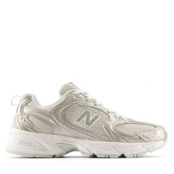 Damskie tenisówki New Balance. Żółte trampki damskie New Balance, bez wzorów, z materiału, bez zapięcia. Za 530.40 zł.