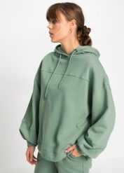 Bluza z kapturem oversized, z miękkiego materiału z bawełną. Zielone bluzy damskie bonprix, bez wzorów, z bawełny, z kapturem. Za 99.99 zł.