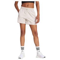 Damskie szorty tkane adidas Essentials 3-Stripes. Brązowe spodenki sportowe damskie Adidas, l, bez wzorów, z materiału, na fitness i siłownię. Za 165.50 zł.
