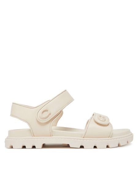 Coach Sandały CS094 Écru. Sandały damskie Coach, bez wzorów, ze skóry, bez obcasa, na płaskiej podeszwie, bez zapięcia. Za 869.99 zł.