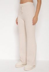 Jasnobeżowe Prążkowane Spodnie z Wełną o Szerokim Kroju z Wysokim Stanem Reinnia. Brązowe spodnie materiałowe damskie Born2be, bez wzorów, z jeansu. Za 79.99 zł.