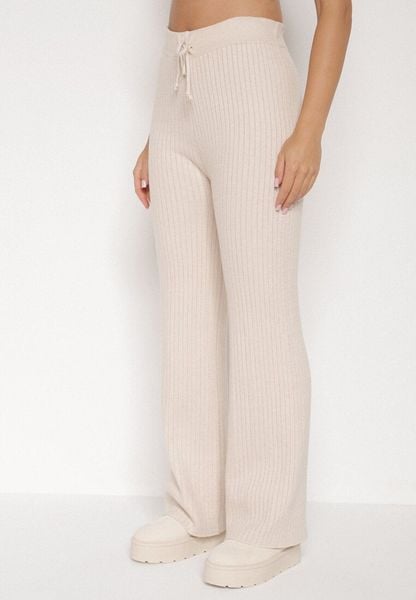 Jasnobeżowe Prążkowane Spodnie z Wełną o Szerokim Kroju z Wysokim Stanem Reinnia. Brązowe spodnie materiałowe damskie Born2be, bez wzorów, z jeansu. Za 79.99 zł.