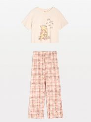 Bawełniana piżama dwuczęściowa Winnie the Pooh - kremowy. Białe piżamy damskie Sinsay, bez wzorów, z bawełny, bez ramiączek. Za 59.99 zł.