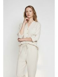 ASSUILI Lniana bluzka w kolorze kremowym rozmiar: 42. Brązowe bluzki damskie Assuili, bez wzorów, ze lnu, bez kołnierzyka, bez ramiączek. Za 130.99 zł.