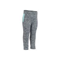 Spodnie 560. Niebieskie spodnie materiałowe dziewczęce DOMYOS. W wyprzedaży za 24.99 zł.