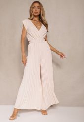 Beżowy Kopertowy Kombinezon Wide Leg Zdobiony Plisami i Paskiem z Klamrą Salirella. Brązowe sukienki damskie Renee, z aplikacjami, eleganckie, bez ramiączek. W wyprzedaży za 91.99 zł.