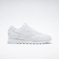 Buty do chodzenia damskie Reebok Glide. Białe obuwie sportowe damskie Reebok, z gumy, bez zapięcia, trekkingowe. Za 264.00 zł.
