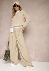 Beżowe Spodnie z Wiskozy Palazzo High Waist Zapinane na Suwak Nellieva. Brązowe spodnie materiałowe damskie Renee, bez wzorów, z jeansu. Za 139.99 zł.