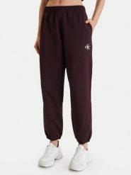 Calvin Klein Jeans Spodnie dresowe Monologo LV047B235G Brązowy Regular Fit. Brązowe spodnie dresowe damskie Calvin Klein Jeans, m, bez wzorów, z bawełny. Za 309.99 zł.