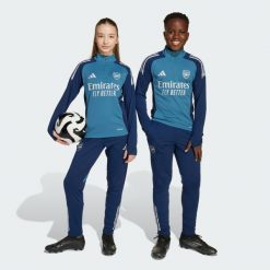 Spodnie treningowe Arsenal Tiro 25 Competition. Niebieskie spodnie dresowe damskie Adidas, bez wzorów, z dresówki. Za 259.00 zł.