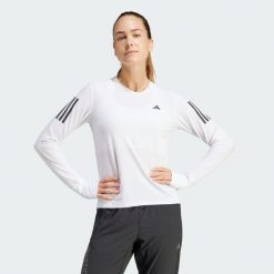 Koszulka Own The Run Long Sleeve. Białe koszulki damskie Adidas, xs, bez wzorów, z materiału, bez kołnierzyka, bez ramiączek. Za 199.00 zł.