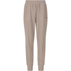 Damskie spodnie dresowe Athlecia Reiley. Brązowe spodnie materiałowe damskie Athlecia, bez wzorów, z dresówki. Za 251.50 zł.