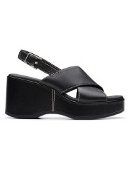 Clarks Skórzane sandały "Manon Wish" w kolorze czarnym na koturnie rozmiar: 38. Czarne sandały damskie Clarks, bez wzorów, z otwartym noskiem, bez obcasa, na koturnie, bez zapięcia. Za 241.56 zł.