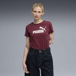 Damska koszulka z logo ESS No. 1 PUMA Ruby Shimmer Red. Czerwone bluzki damskie Puma, bez wzorów, sportowe, bez kołnierzyka, bez ramiączek. Za 134.21 zł.