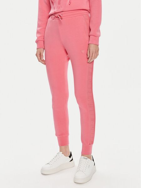 Guess Spodnie dresowe V2YB18 K7UW2 Różowy Regular Fit. Czerwone spodnie dresowe damskie Guess, xl, z aplikacjami, z dresówki. Za 189.99 zł.