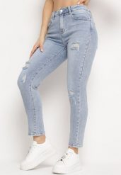 Jasnoniebieskie Jeansy o Fasonie Regular Ozdobione Przetarciami Ivispia. Niebieskie jeansy damskie Born2be. Za 99.99 zł.