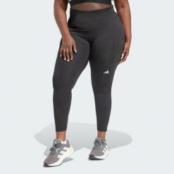 Legginsy Own the Run 7/8 (Plus Size). Czarne legginsy damskie Adidas, plus size, bez wzorów, z materiału. W wyprzedaży za 181.35 zł.