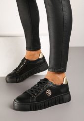Czarno-Złote Sneakersy Vices na Grubej Tłoczonej Podeszwie ze Sznurowaniem i Metaliczną Ozdobą Ulfedi. Czarne obuwie sportowe damskie Born2be, z jeansu, bez zapięcia. Za 99.99 zł.
