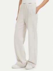 Calvin Klein Jeans Spodnie dresowe LV047G253G Kremowy Relaxed Fit. Białe spodnie dresowe damskie Calvin Klein Jeans, xl, bez wzorów, z bawełny. Za 409.99 zł.