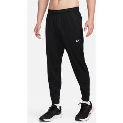 Spodnie sportowe damskie Nike Totality. Czarne spodnie dresowe damskie Nike, l, bez wzorów, z dresówki. Za 397.00 zł.