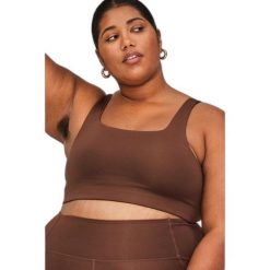 Kobiałka z kwadratowym dekoltem Girlfriend Collective Tommy. Białe biustonosze sportowe damskie GIRLFRIEND COLLECTIVE, bez wzorów. Za 257.50 zł.